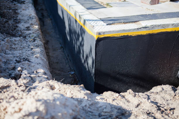 Professional Waterproofing technician working in Latham, OH